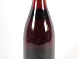 a bottle of wine that is sitting on a table