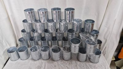 a pile of tin cans stacked on top of each other
