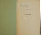 an old book with a handwritten title and a green cover