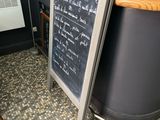 a chalk board with writing on it in a restaurant
