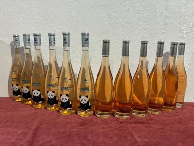 six bottles of wine are lined up in a row on a table