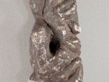 an image of a sculpture of a woman holding her head