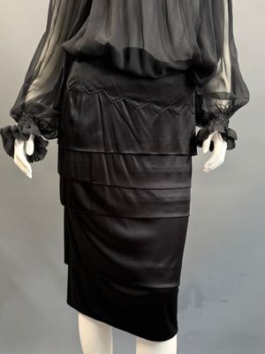 an image of a mannequin wearing a black dress on a mannequin mannequin mannequin mannequin mannequin mannequin mann