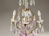 a close up of a chandelier hanging from a ceiling