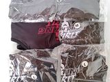 six pairs of underwear wrapped in plastic bags on a white surface