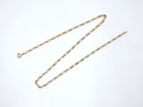 a gold chain on a white background