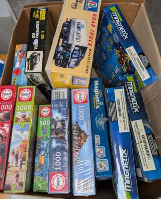 a box full of assorted toys and games for sale