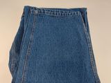 a close up of a pair of jeans on a white surface