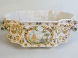 a large white bowl with a floral design on it