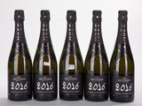 six bottles of champagne are lined up in a row
