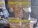 many boxes stacked on a pallet in a warehouse