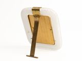 a picture of a wooden picture frame with a metal holder