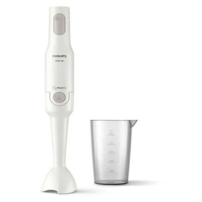 a blender that is sitting next to a measuring cup