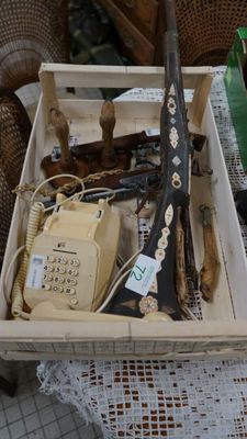 a wooden box filled with assorted items on a table