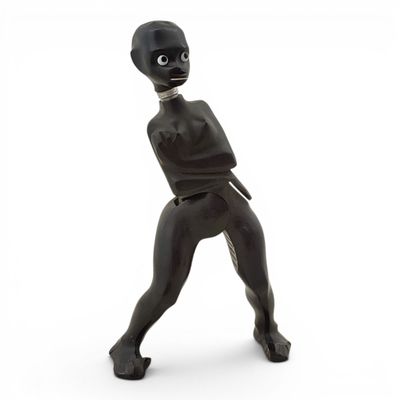statue of an alien with a gun in his hand on a white background