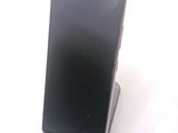 a cell phone that is sitting on top of a stand