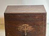 a small wooden box sitting on top of a table