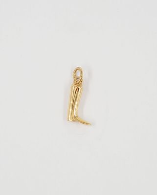 a gold plated charm with the letter l on it