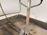 a hand truck that is sitting in the middle of a room