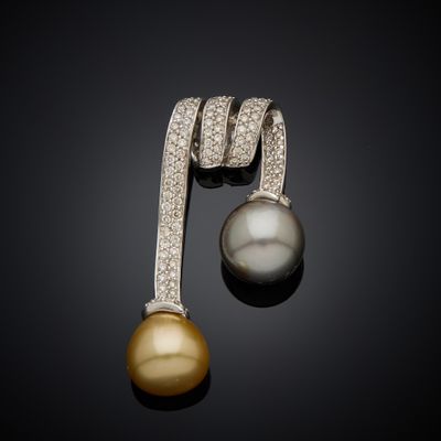 a pair of pearl and diamond earrings
