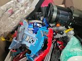 a cardboard box full of assorted electronics and other items