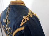 a blue uniform with gold decorations on it