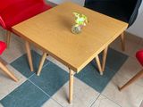two chairs and a table in the corner of a room