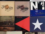 various albums of the beatles are arranged on the floor