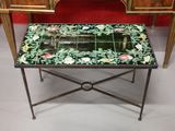 a small table with a mirror on top of it