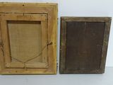 two old wooden frames are sitting next to each other on a white surface