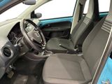 the interior of a small blue car with a steering wheel