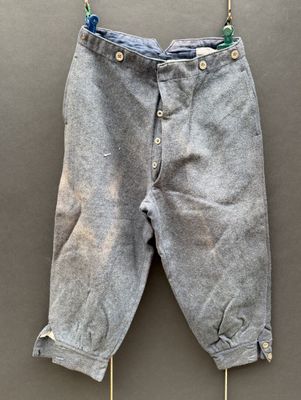 a close up of a pair of pants hanging on a clothes line