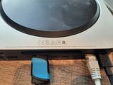 a small device that is connected to a charger on a table