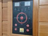 an image of a wooden saunat with a digital timer