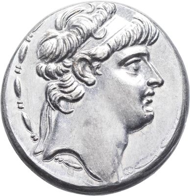 a close up of a coin with a woman ' s head on it