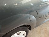 a close up of a car that has a denting on it
