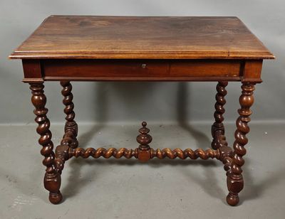 an old wooden table with a drawer on top of it