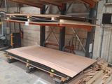a large pile of wood sitting on a pallet in a garage