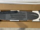 a box with a skateboard inside of it on the floor