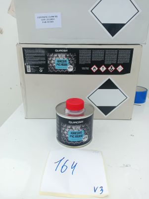 a picture of a box with a sign and a can of paint next to it