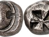 a close up of two metal buttons with a cross on them