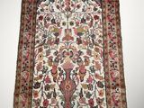 an antique persian rug with a floral design on a white background