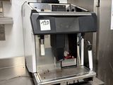 a coffee machine that is sitting on top of a counter