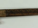 an image of a knife that is on a wall