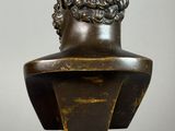 pair of bronze busts of a man and a woman