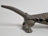 an image of a metal toy of a lizard