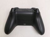 a close up of a video game controller on a table