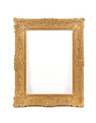 a gold frame with a white background and a white wall