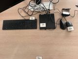 a desk with a keyboard, mouse, and a monitor on it