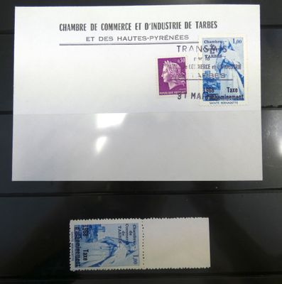 two stamps on display in a glass case on a black surface